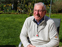 Photo of a man wearing a Careline365 device